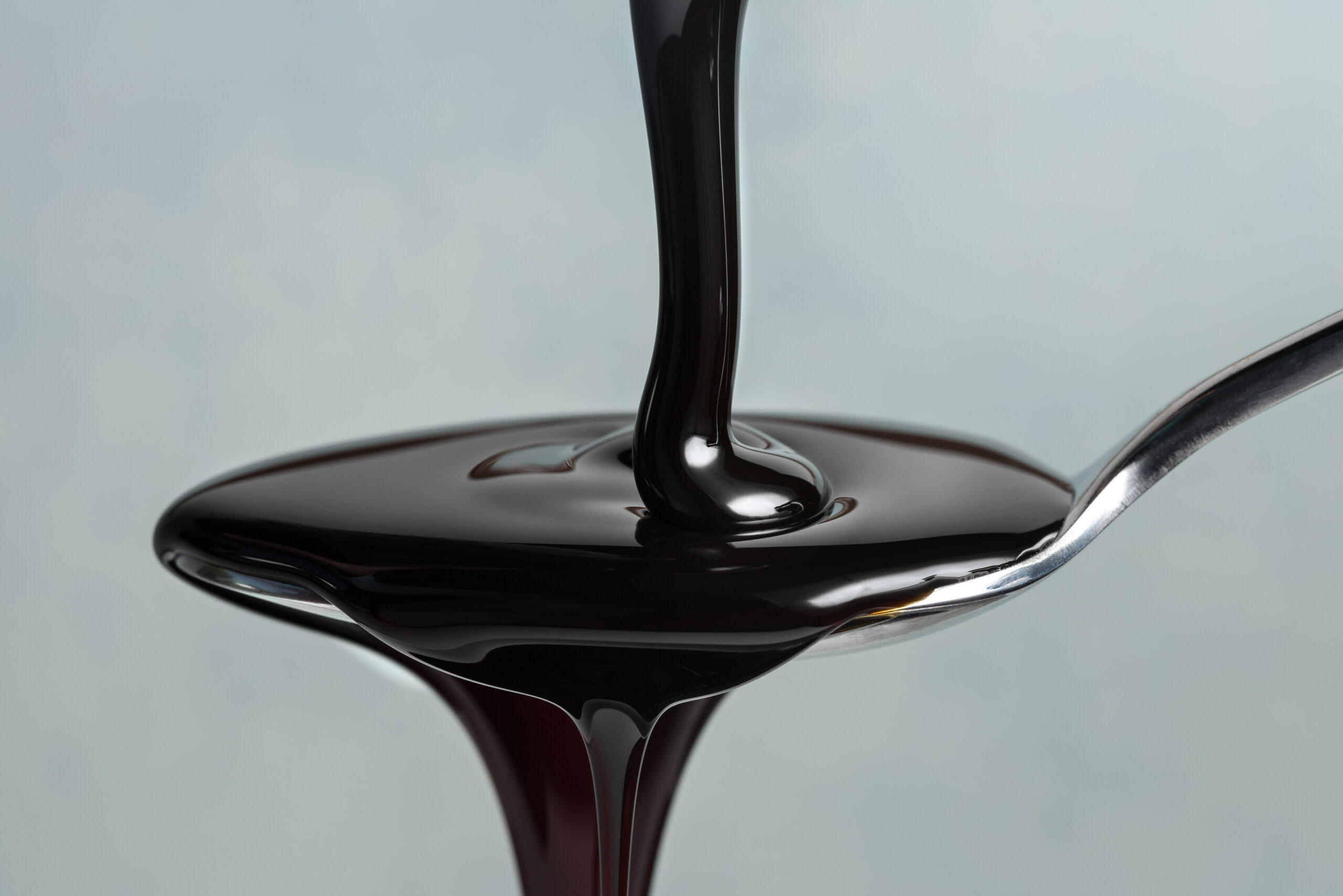 Pouring,Molasses,On,A,Spoon